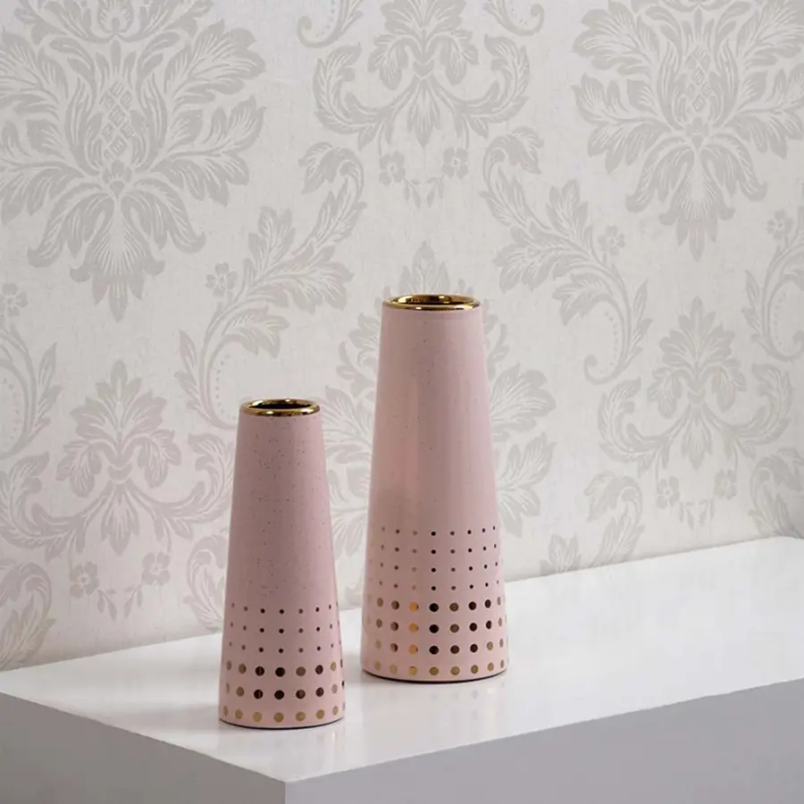Pink ceramic vase with gold accents shown in a grouped decor setup highlighting its modern dotted pattern for elegant interior styling.