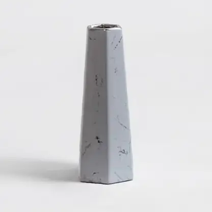 Modern white marble ceramic vase with smooth finish and geometric design crafted for stylish living room decor.