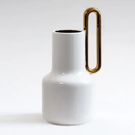 White ceramic vase with gold handle detail for tabletop styling and modern luxury home decor arrangements.