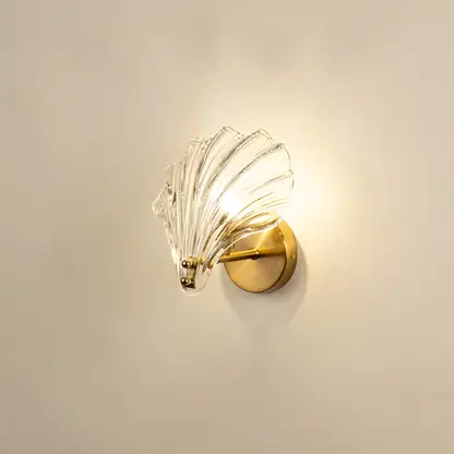 Black metal and glass pendant light imagined with warm bulbs on against a white background highlighting its modern frame and soft illuminating glow.
