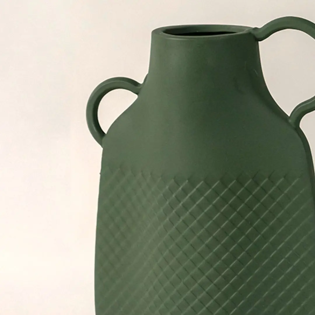 Closeup of Haven vase showcasing detailed geometric texture and smooth matte ceramic craftsmanship.
