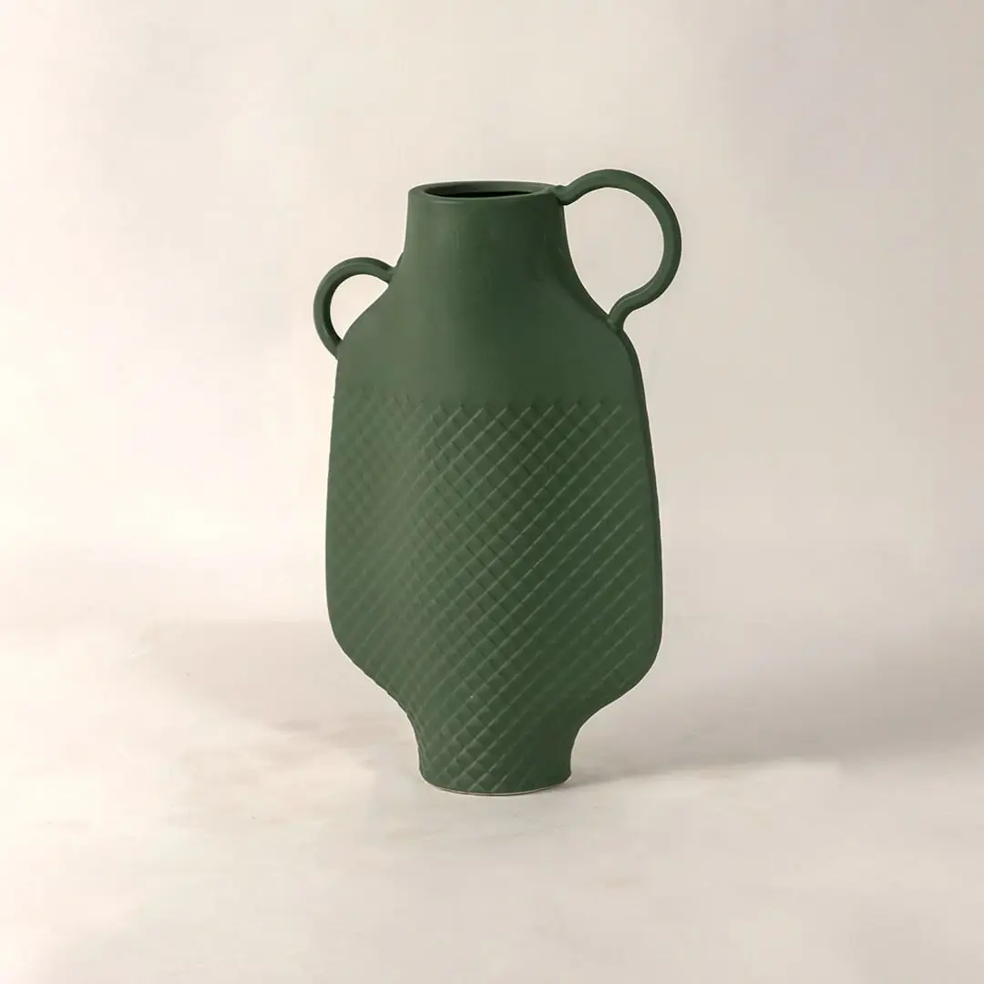 Side view of Haven green vase highlighting its curved silhouette geometric texture and modern twin handle design.