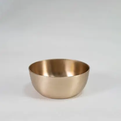 Plain brass tumbler with cylindrical shape and matte metallic finish displayed upright on clean white background.