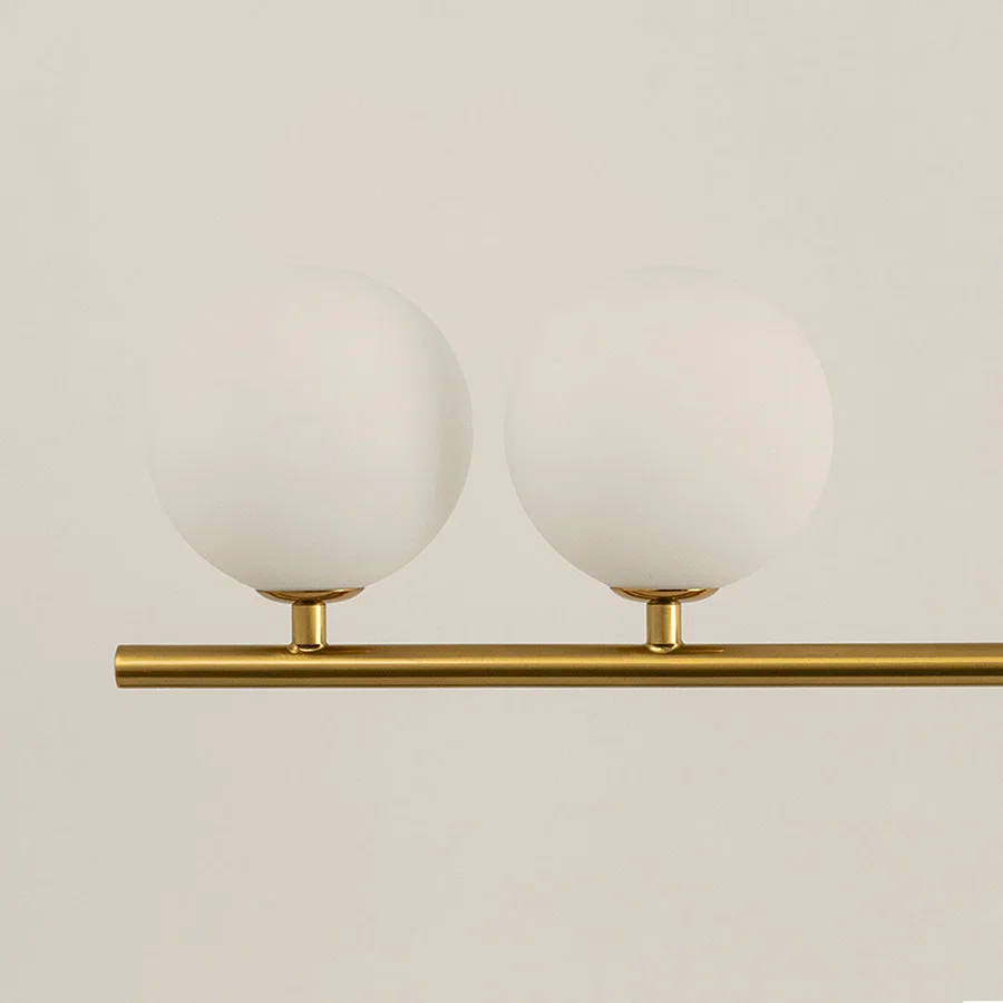 Frosted glass globe chandelier with gold metal frame showcasing elegant craftsmanship and modern decorative lighting.