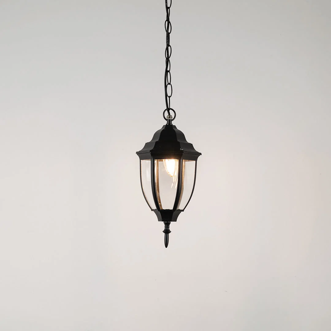 Elegant black metal hanging lantern light with clear curved glass for stylish outdoor lighting decor.