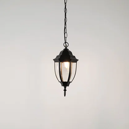 Elegant black metal hanging lantern light with clear curved glass for stylish outdoor lighting decor.