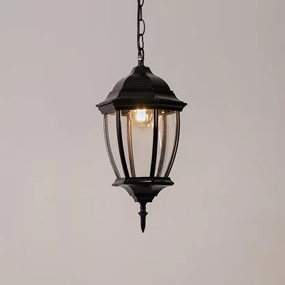 Modern black metal hanging lantern light with warm glow for elegant balcony and patio lighting.
