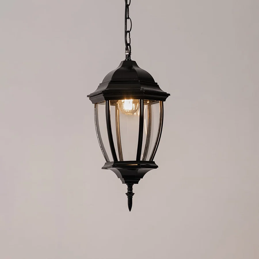 Modern black metal hanging lantern light with warm glow for elegant balcony and patio lighting.