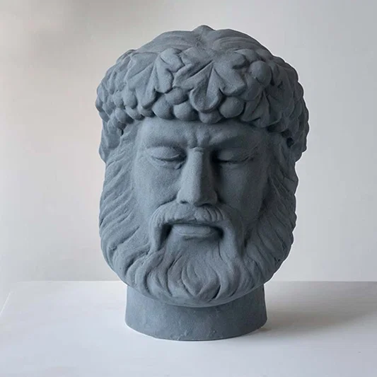 Grey ceramic decorative face sculpture with classical portrait design for elegant tabletop styling and home decor.