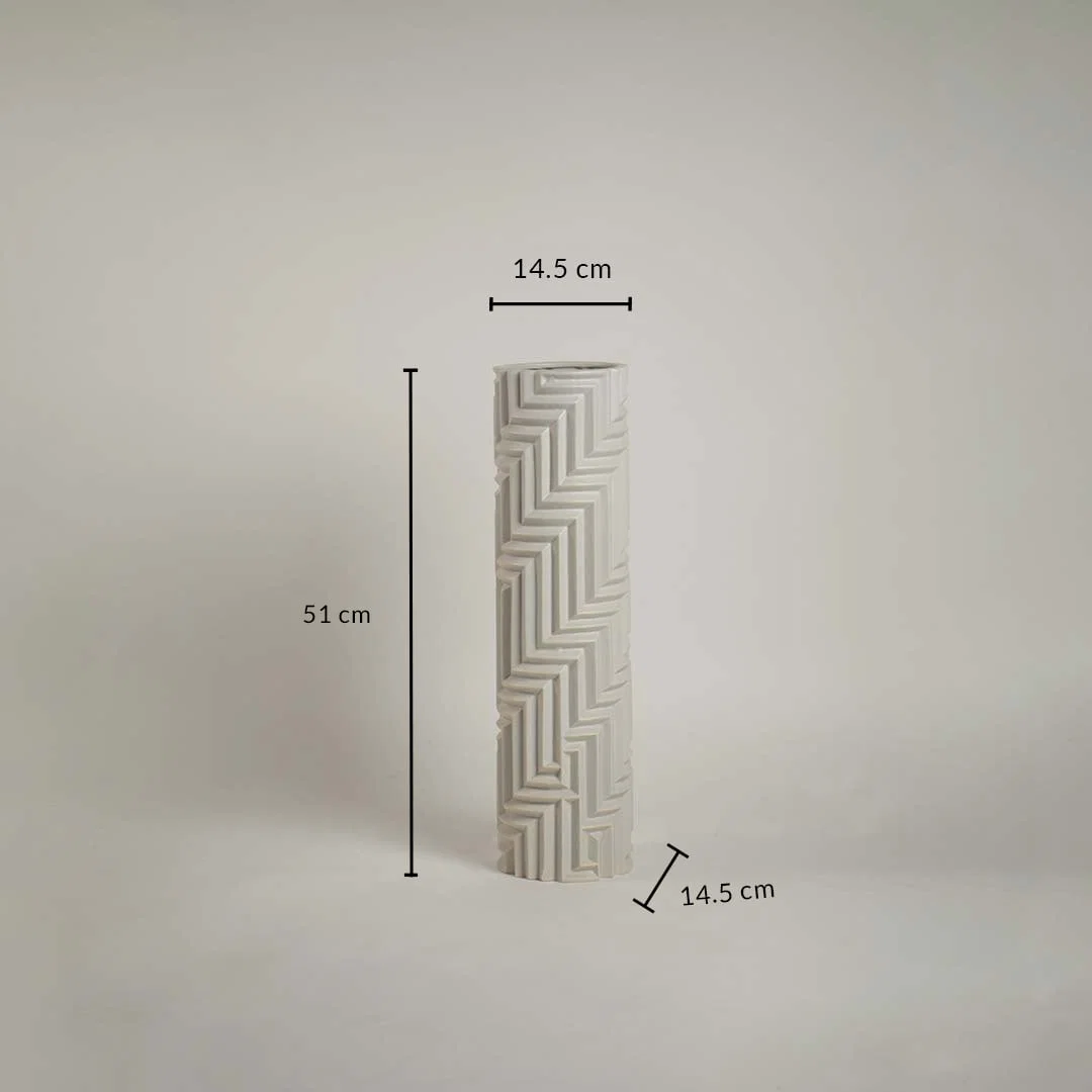Tall white geometric ceramic vase with 51 cm height and 14.5 cm width displayed on a neutral background with intricate line detailing.