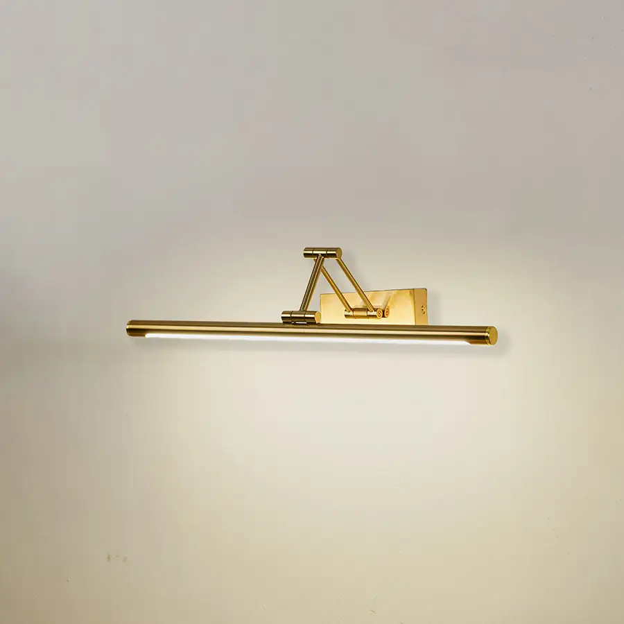 Modern wall light in gold metal finish with linear bar design for bathroom or vanity decor lighting white background.