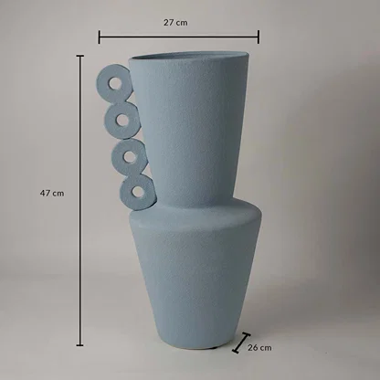 Blue ceramic vase measuring 47 cm height and 27 cm width shown on white background with circular ring handle design.
