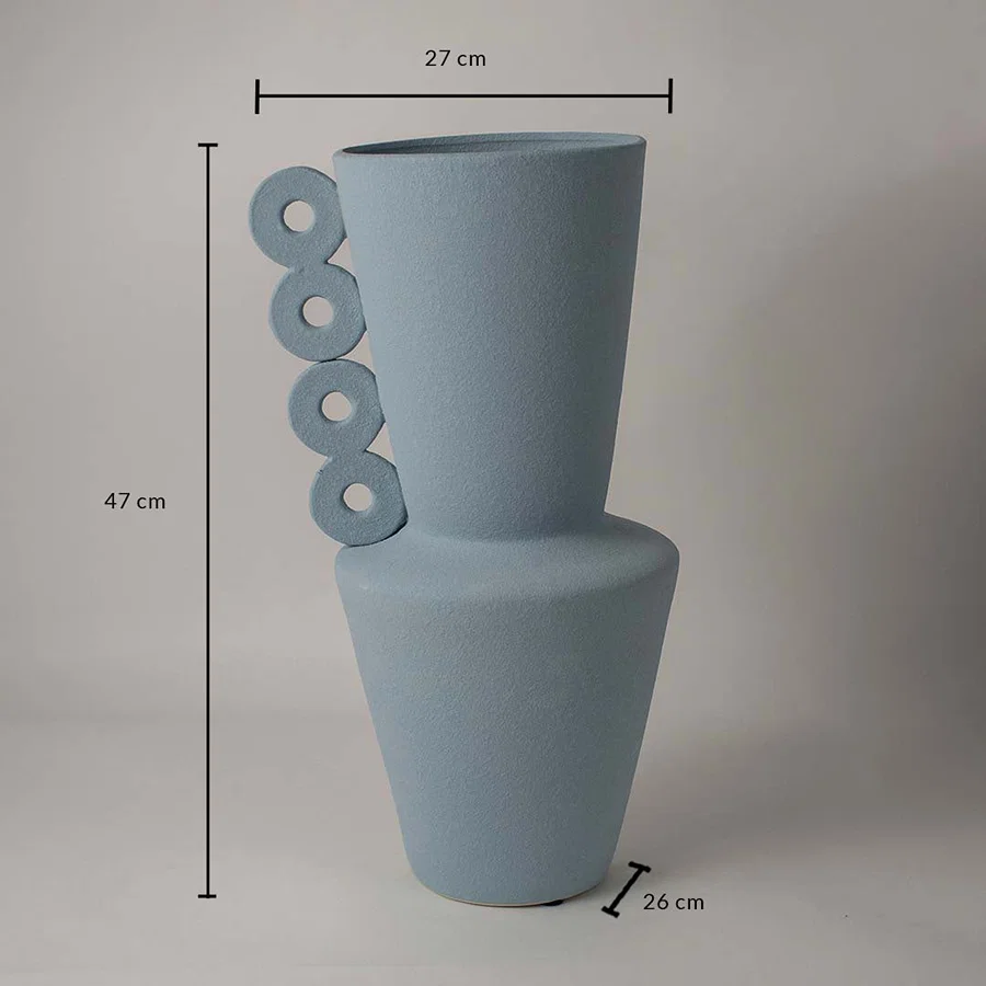 Blue ceramic vase measuring 47 cm height and 27 cm width shown on white background with circular ring handle design.