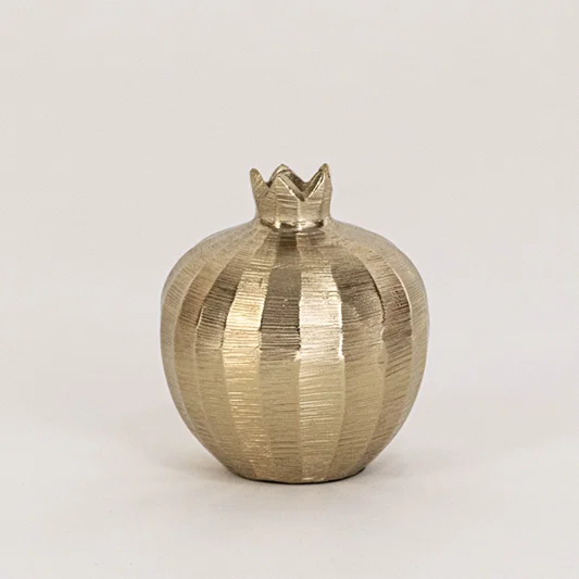 Textured metal decor bowl in gold finish with crown lid for table decor or shelf styling modern home placement white background.