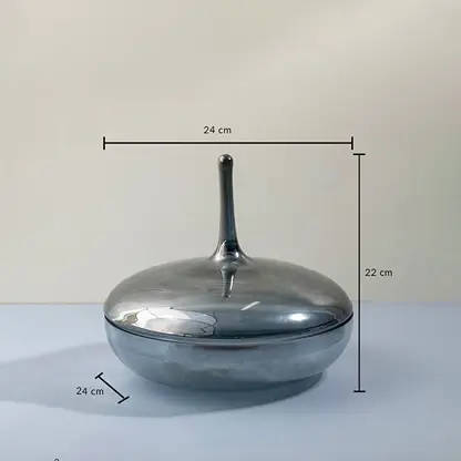 Grey glass jar with tall lid shown with 22 cm height and 24 cm width measurements for modern decorative use.
