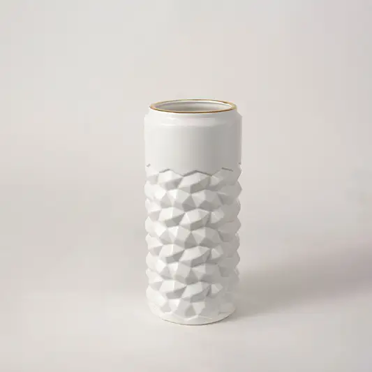 White ceramic decorative vase with raised bubble pattern and gold rim for elegant modern home decor styling.