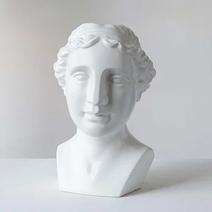 White ceramic decorative bust sculpture with classical Greek design for contemporary shelf styling and home decor.