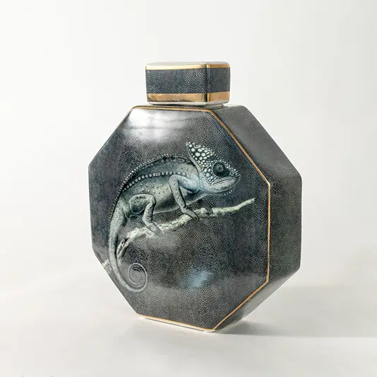 Grey ceramic decorative jar with marble effect and gold lid for luxury shelf styling and contemporary home decor displays.