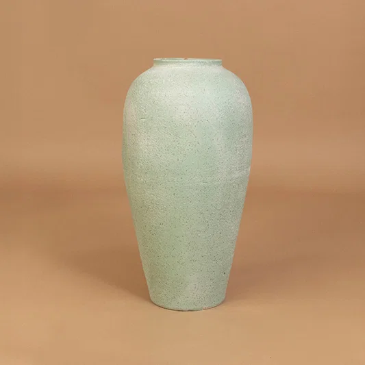 Minimal mint green ceramic vase for elegant shelf bedroom and modern home decor styling inspiration.