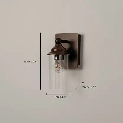 Bronze wall sconce with clear glass shade, base 23 x 12 x 13 cm (9.1 x 4.7 x 5.1 inches), canopy 15 x 12 cm (5.9 x 4.7 inches) dimensions