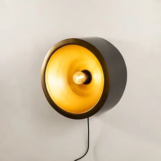 Wall light with round design and warm glow perfect for modern bedroom or hallway wall decor placement on clean background.