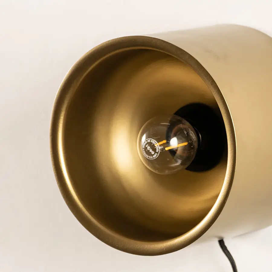 Closeup of wall light with gold metal dome shade showing smooth finish and modern design for interior wall decor styling.