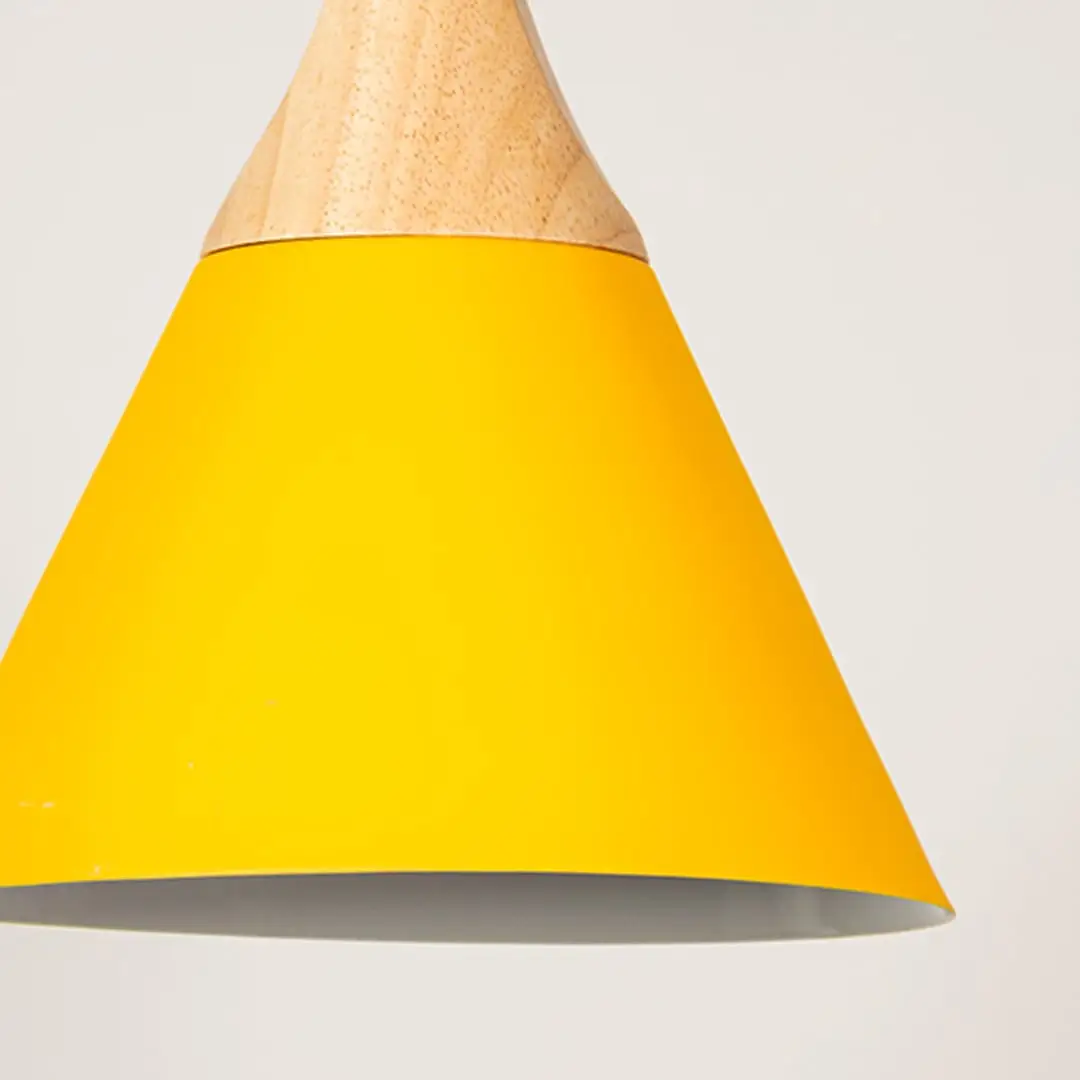 Yellow metal pendant light with natural wood detailing showcasing wide cone shape and modern Scandinavian style.