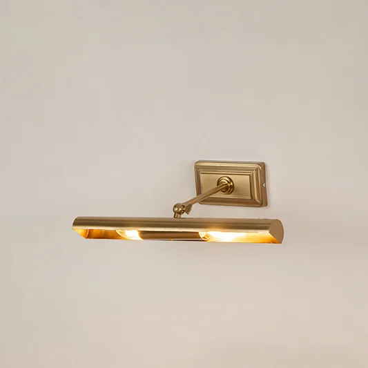 Elegant wall light in gold metal finish with linear bar design for bathroom or vanity decor lighting white background.