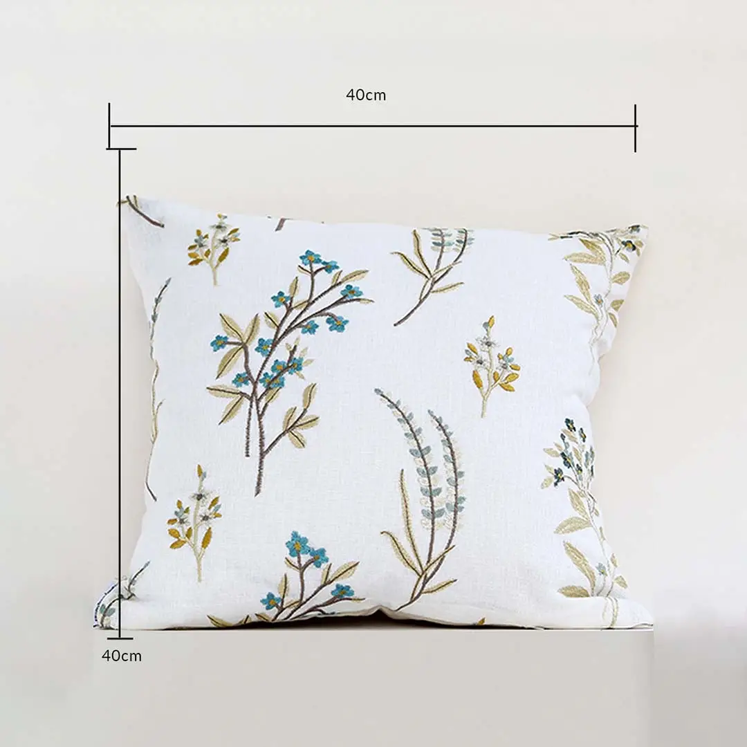 A white background dimensions image showing a floral embroidered cushion measuring 40 cm by 40 cm with botanical patterns clearly visible across the front surface.