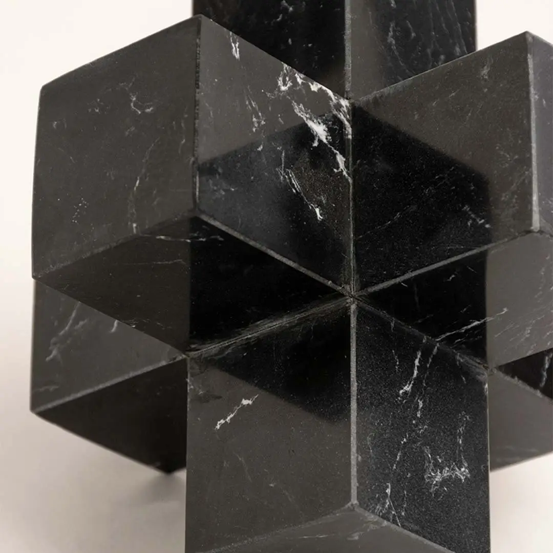 Black marble decorative sculpture with geometric cube design for luxury tabletop styling and modern home decor.