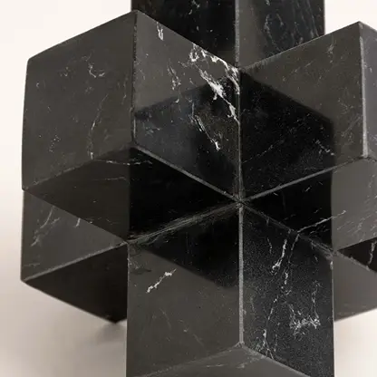 Black marble decorative sculpture with geometric cube design for luxury tabletop styling and modern home decor.