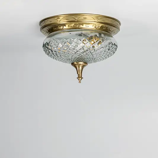Antique brass crystal ceiling light with faceted glass shade for elegant hallway and classic home decor spaces.