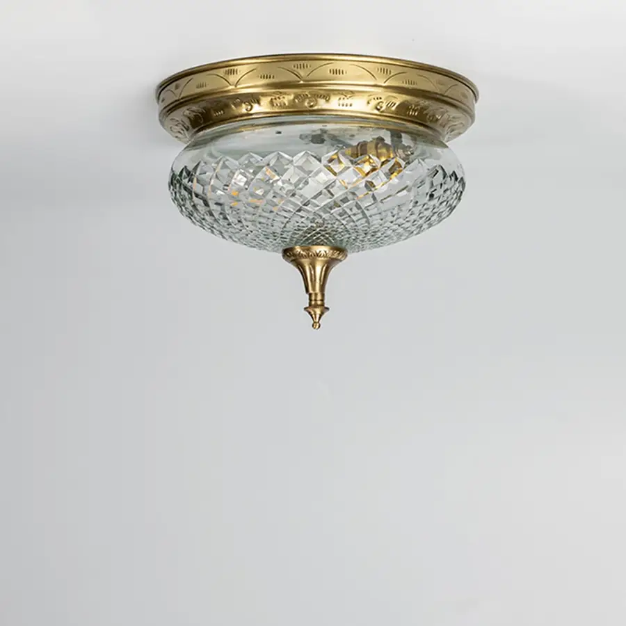 Antique brass crystal ceiling light with faceted glass shade for elegant hallway and classic home decor spaces.