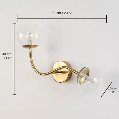 Clear glass globe double arm wall lamp with gold base, base 30 x 12 x 40 cm (11.8 x 4.7 x 15.7 inches), canopy 10 x 10 cm (3.9 x 3.9 inches) dimensions