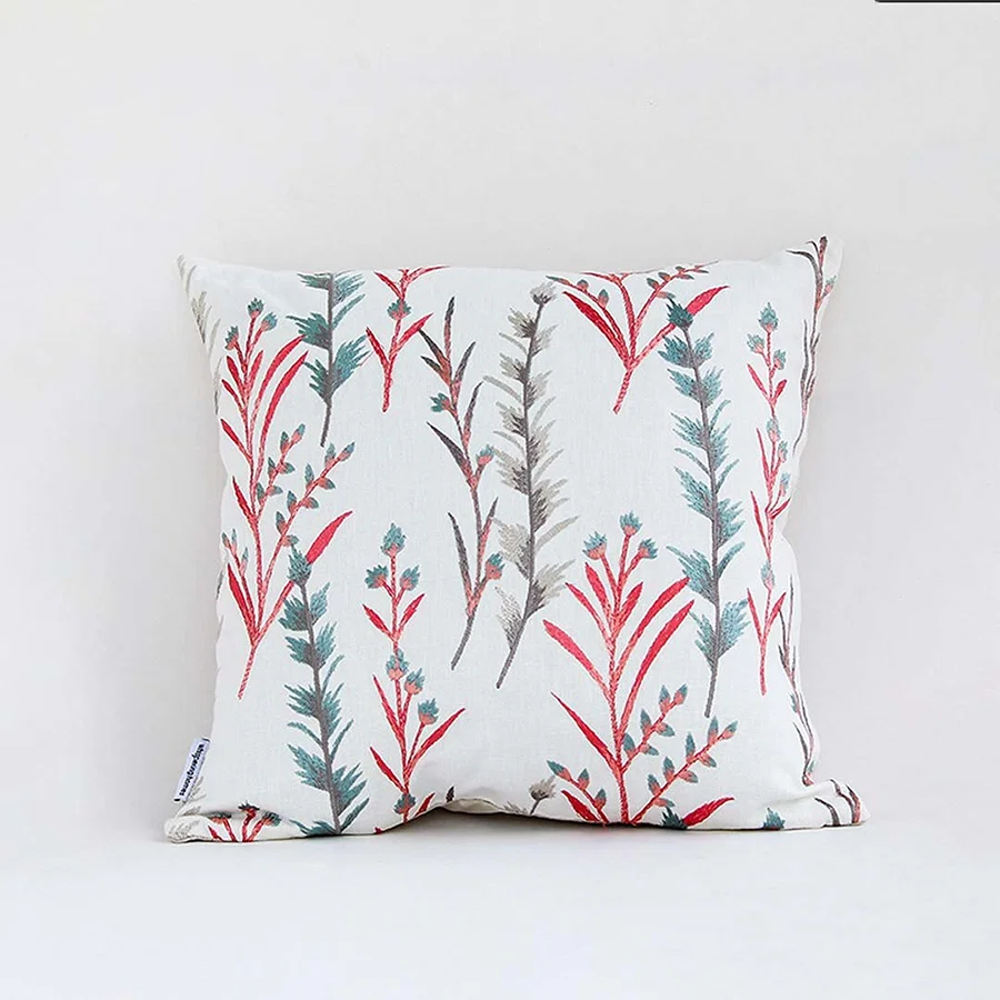 White cotton cushion cover with yellow floral print for sofa couch bedroom and elegant home decor styling.