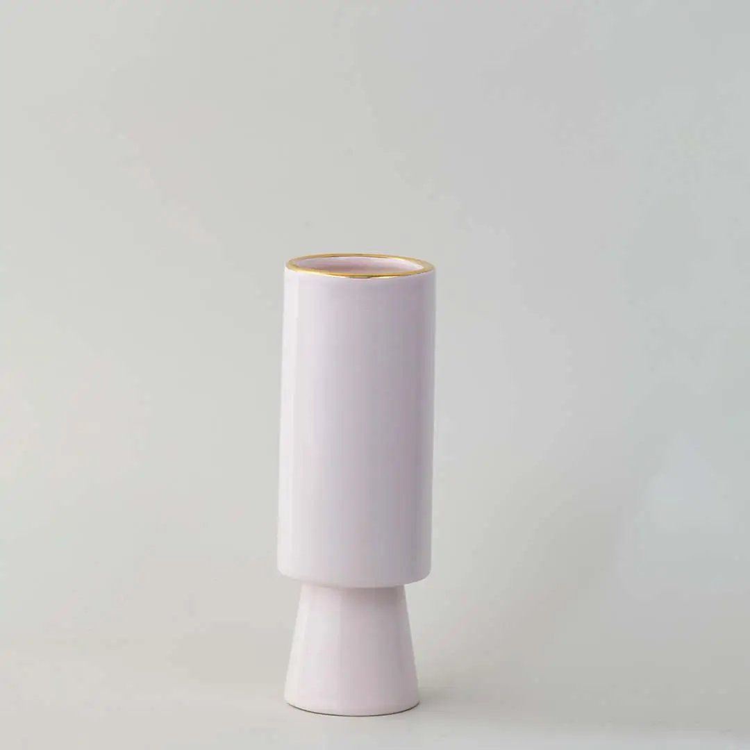 Pastel pink tiered ceramic cylinder vase featuring a delicate metallic gold rim accent on white background for chic styling.