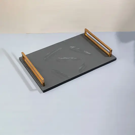 Grey marble decorative tray with gold metal handles for elegant tabletop organization and luxury home decor.