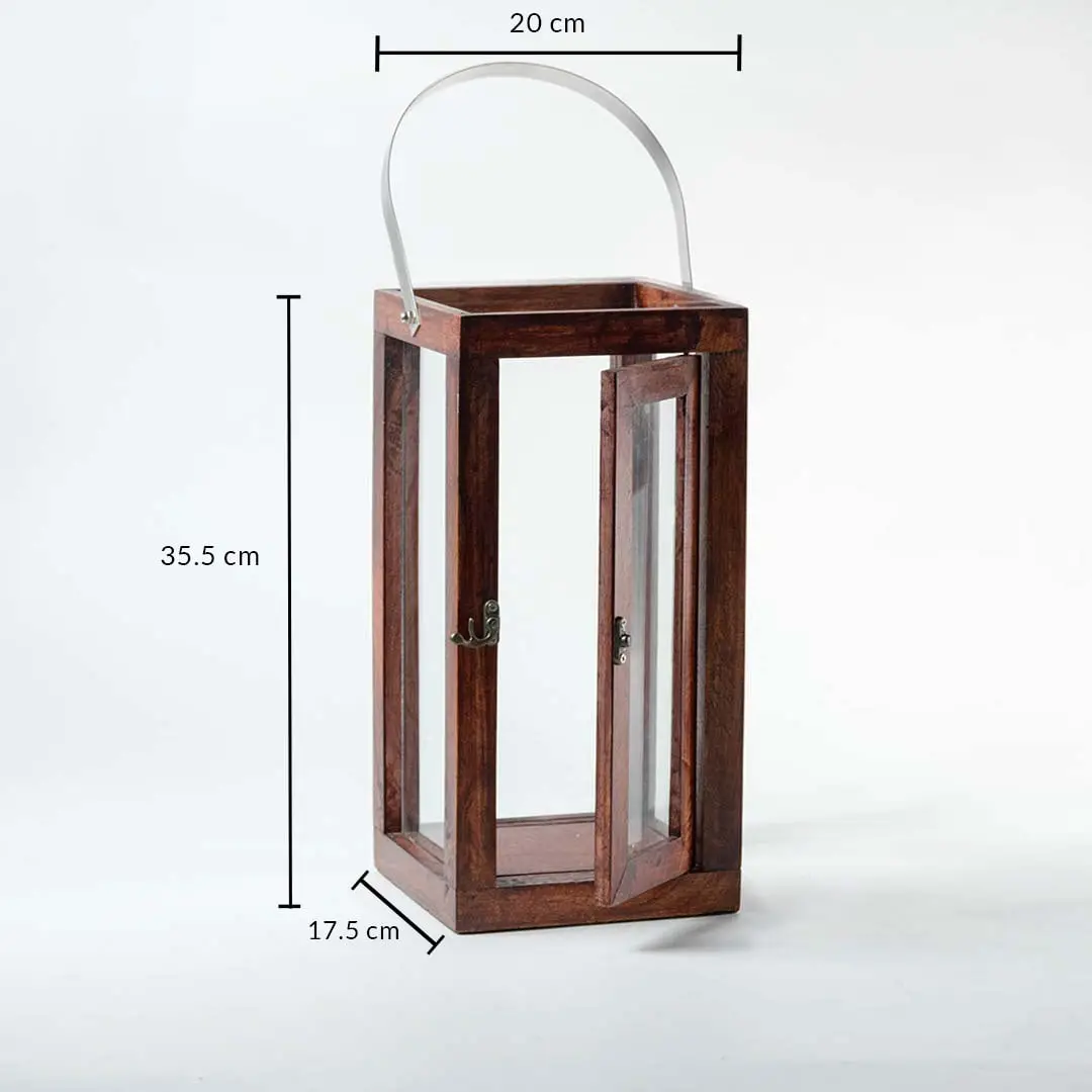 Wood and glass lantern with metal handle measuring 35.5 cm height 20 cm width and 17.5 cm depth on white background.
