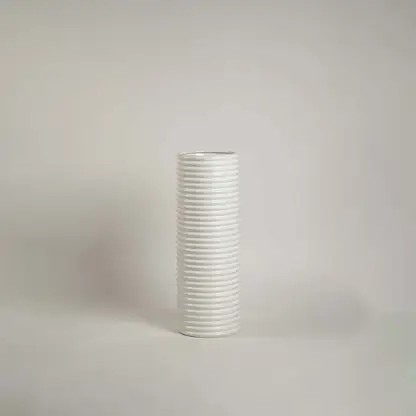 Matte white ceramic cylinder vase featuring a dense horizontal ribbed stacked texture on a clean white background.