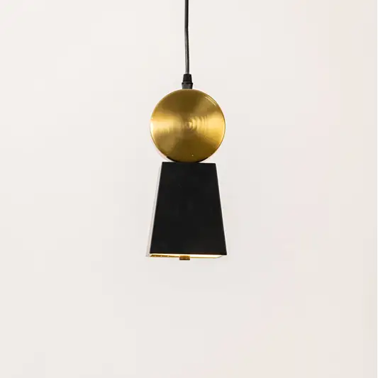 Minimal pendant light in gold and black metal finish with cone design for kitchen or dining decor lighting white background.
