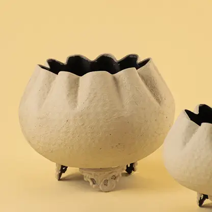 Detailed view of textured white finish on unique bowl planter for sophisticated modern home decor and interior design.