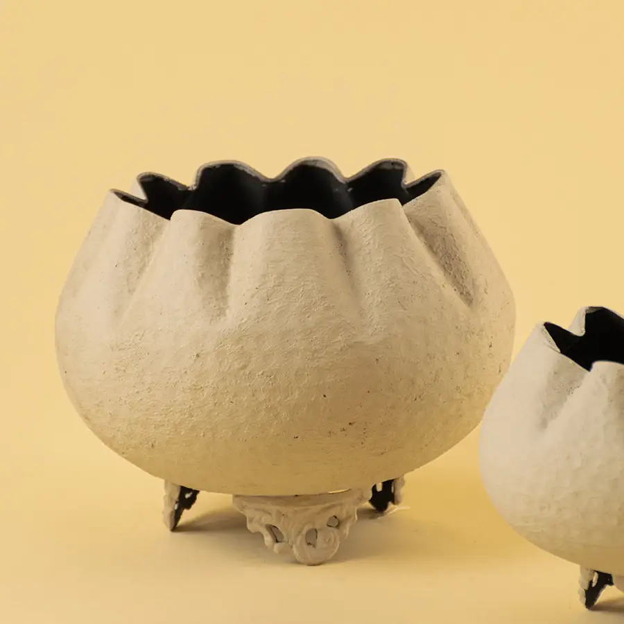 Detailed view of textured white finish on unique bowl planter for sophisticated modern home decor and interior design.
