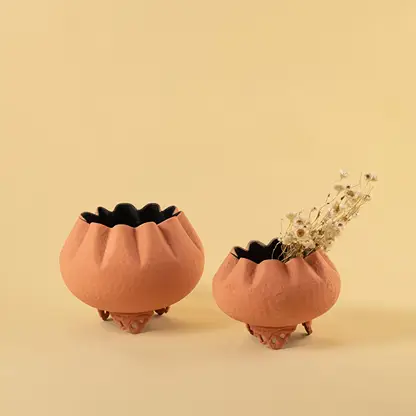 Terracotta metal scalloped bowl planters displayed together creating a warm modern decor look ideal for centre tables and shelves.