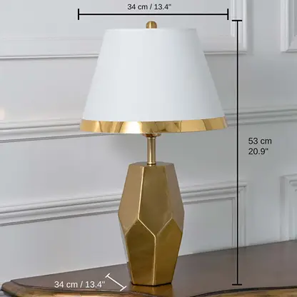 Gold geometric table lamp with white tapered shade, shade 23 x 23 x 34 cm (9.1 x 9.1 x 13.4 inches), body 53 x 16 x 34 cm (20.9 x 6.3 x 13.4 inches) dimensions