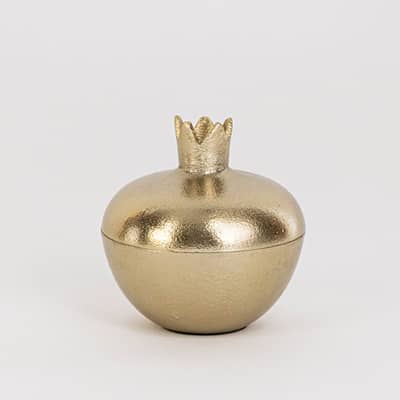 Smooth gold pomegranate-shaped jar with crown top shown on clean white background for clear product presentation