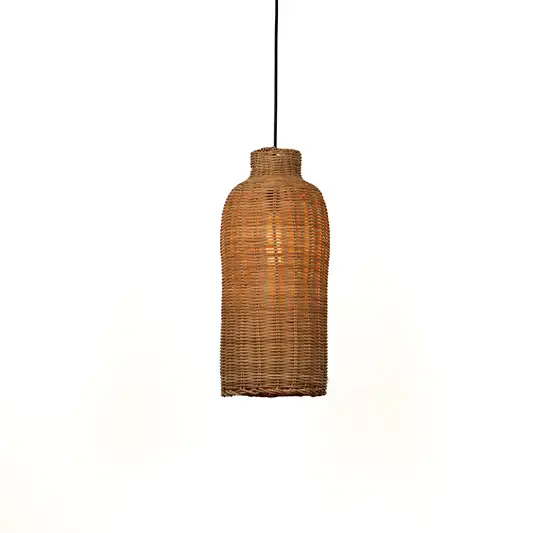 Tall cylindrical rattan pendant light with tight weave texture suspended from cord against simple neutral wall background for earthy contemporary interior design.

