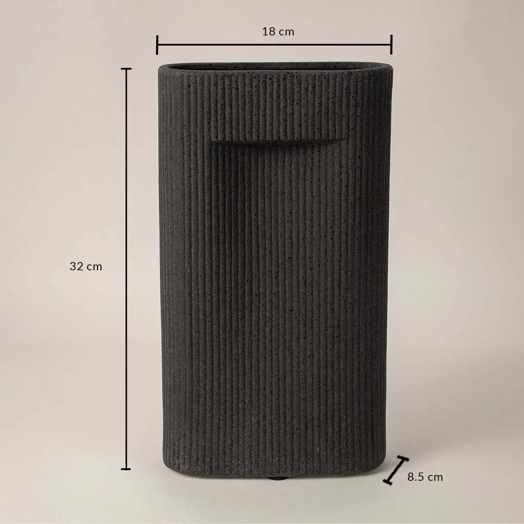 Tall black textured ceramic vase with dimension display placed on white surface against neutral background showcasing size and contemporary home decor design.