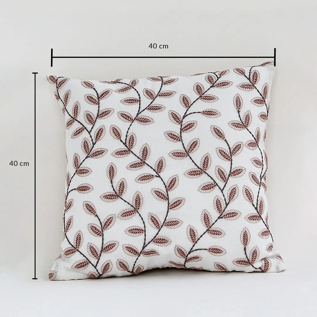 Cotton cushion with brown leaf embroidered pattern measured at 40 cm by 40 cm displayed on a white background showing its square decorative design.