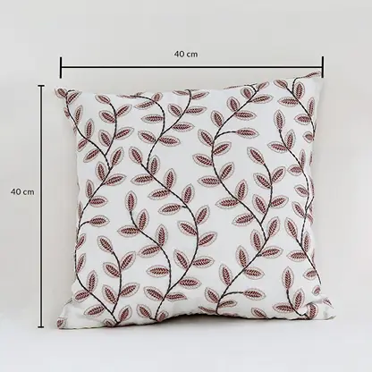 Cotton cushion with brown leaf embroidered pattern measured at 40 cm by 40 cm displayed on a white background showing its square decorative design.