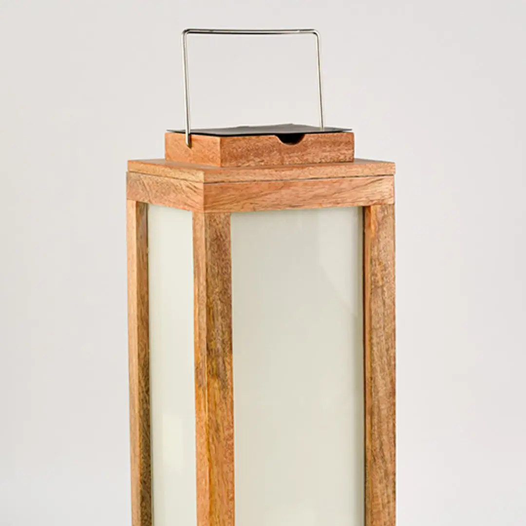 Wooden lantern with natural wood finish and frosted glass panels for elegant tabletop decor styling.